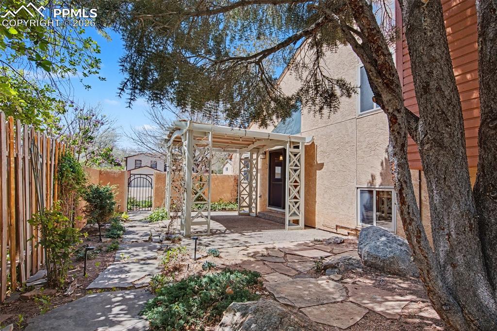 5301 Pinon Valley Road Colorado Springs, CO 80919 - Photo 26 of 27 a front view of a house with a tree