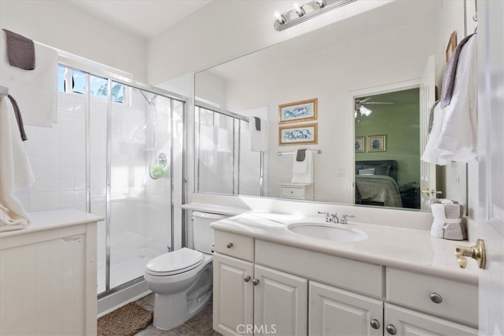 5531 San Carlos Court Rancho Cucamonga, CA 91739 - Photo 19 of 54 a bathroom with a granite countertop sink toilet and shower