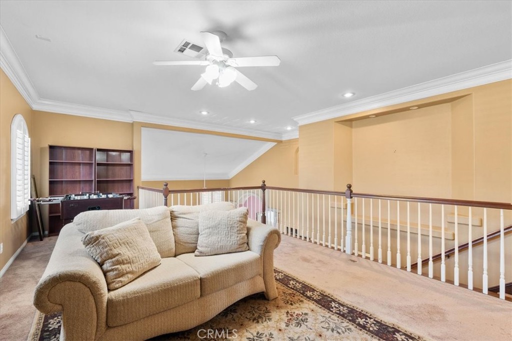 5531 San Carlos Court Rancho Cucamonga, CA 91739 - Photo 24 of 54 a living room with furniture and a chandelier