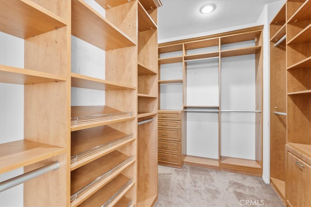 5531 San Carlos Court Rancho Cucamonga, CA 91739 - Photo 34 of 54 a view of walk in closet with empty racks