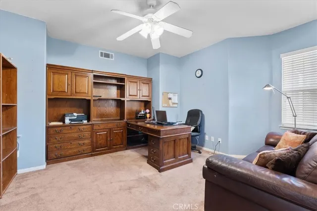a work room with furniture and a window