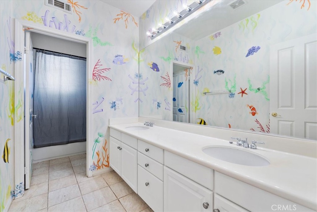 5531 San Carlos Court Rancho Cucamonga, CA 91739 - Photo 38 of 54 a spacious bathroom with a double vanity sink mirror and shower