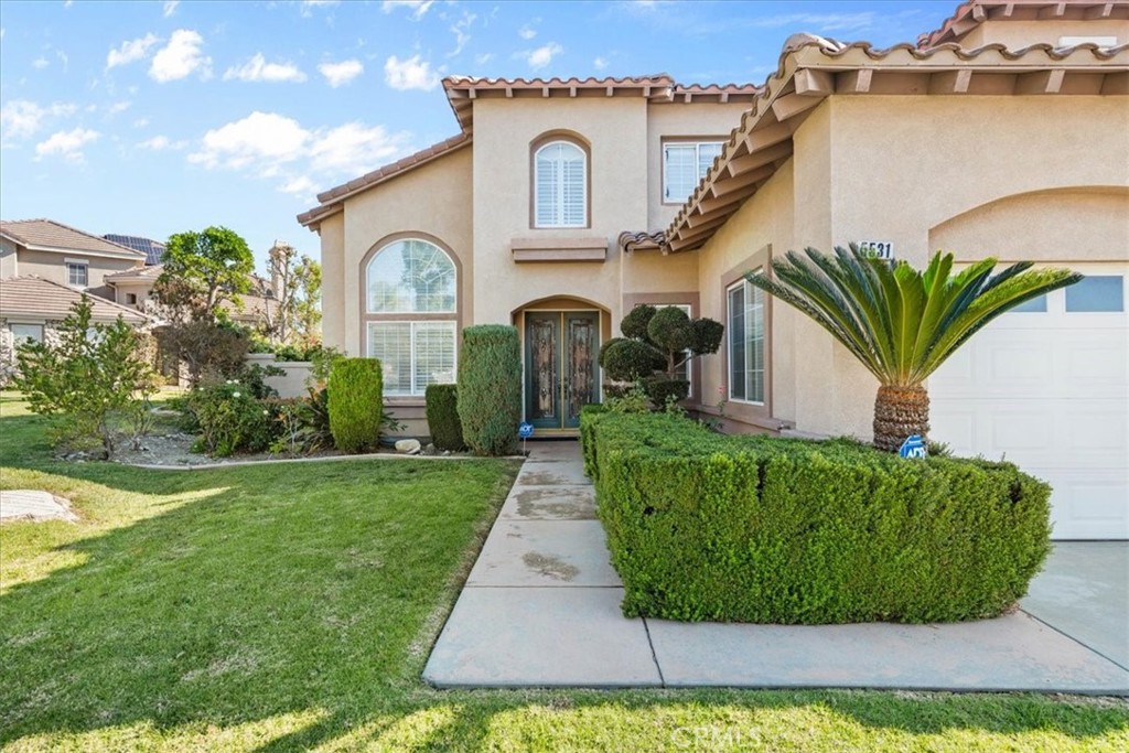 5531 San Carlos Court Rancho Cucamonga, CA 91739 - Photo 41 of 54 a front view of a house with garden