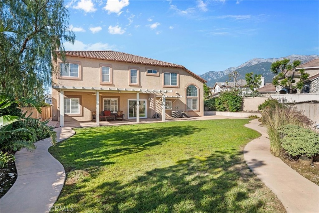 5531 San Carlos Court Rancho Cucamonga, CA 91739 - Photo 44 of 54 a view of a house with a yard porch and sitting area