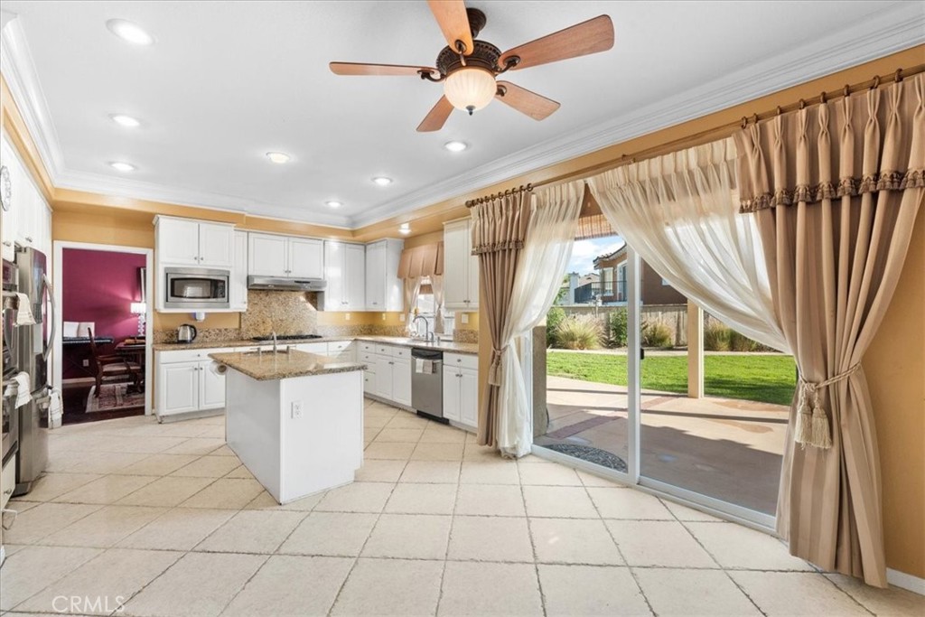 5531 San Carlos Court Rancho Cucamonga, CA 91739 - Photo 9 of 54 a kitchen with stainless steel appliances granite countertop a refrigerator and a sink