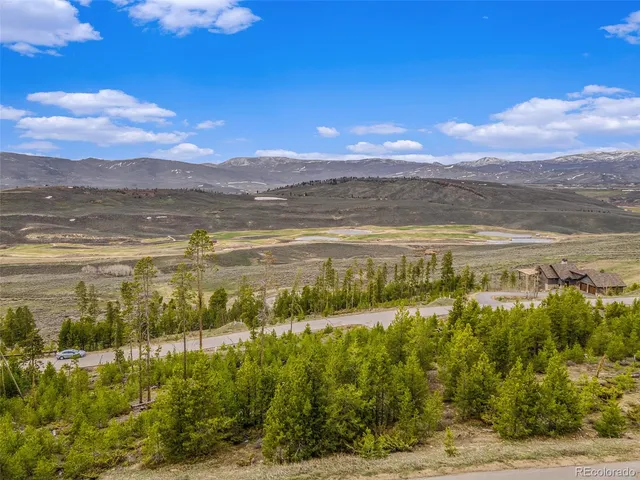 a view of an ocean and a mountain