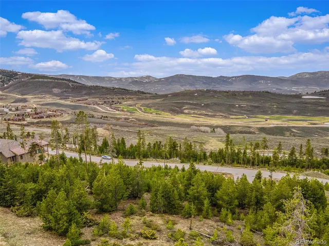 a view of an ocean and a mountain