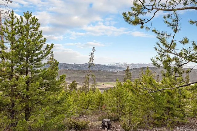 a view of a lake with a building in the background