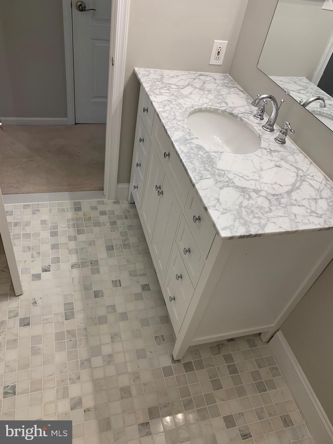 94 Lemonton Way Wayne, PA 19087 - Photo 9 of 12 a bathroom with a granite countertop sink and a mirror