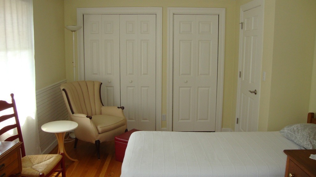 112 Jericho Road, Unit 112 Weston, MA 02493 - Photo 15 of 17 a bedroom with a bed and furniture