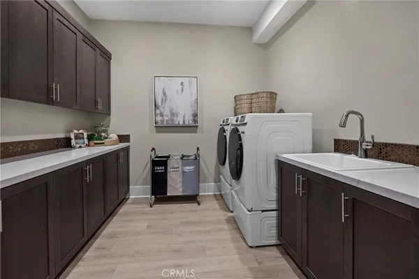 a kitchen with a sink stove and refrigerator