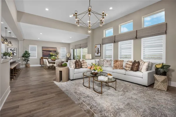 a living room with furniture or kitchen view and a wooden floor