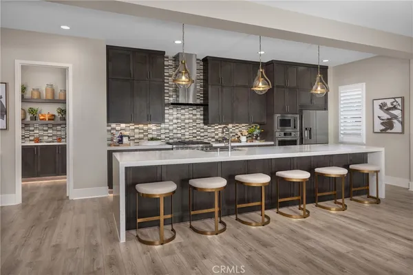 a kitchen with a table and chairs in it