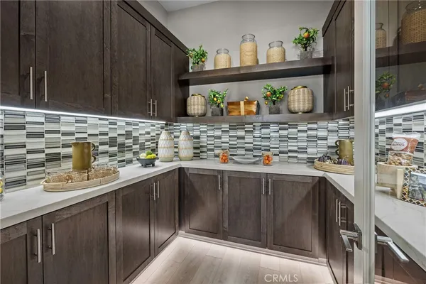 a kitchen with stainless steel appliances granite countertop a sink and a stove
