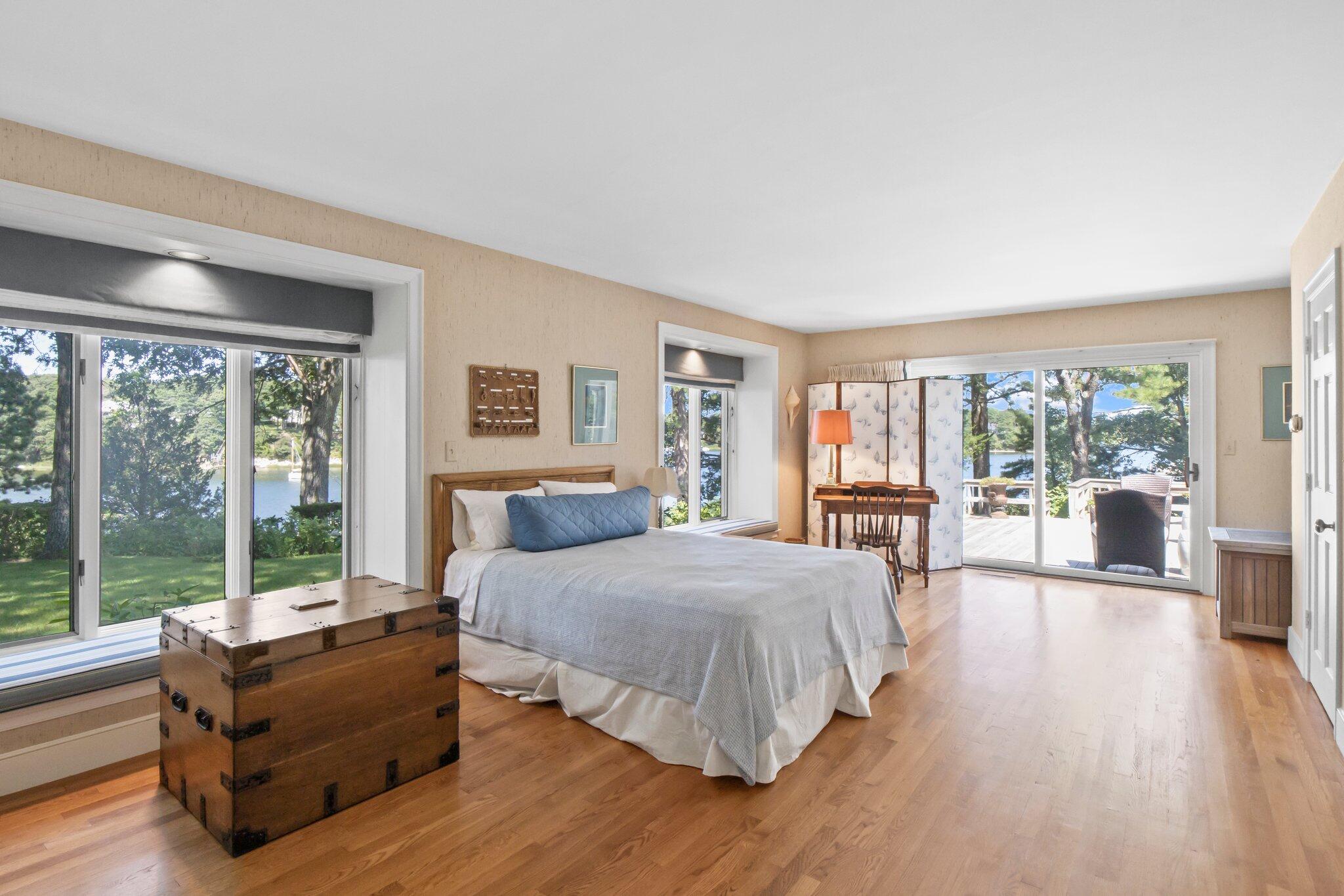 200 North Bay Road Osterville, MA 02655 - Photo 19 of 20 a spacious bedroom with a large bed and a large window