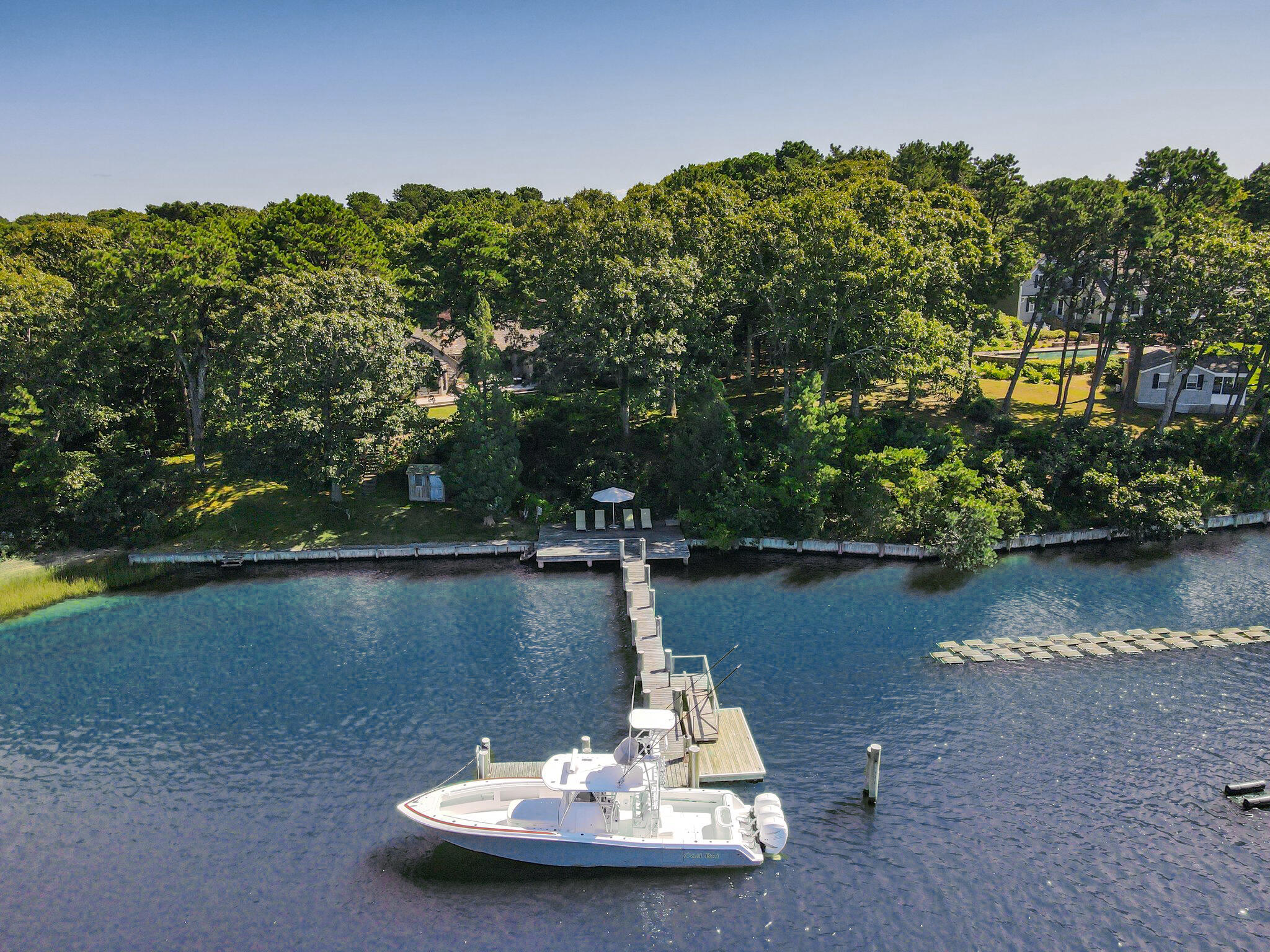 200 North Bay Road Osterville, MA 02655 - Photo 3 of 20 a view of a lake with a house in the background