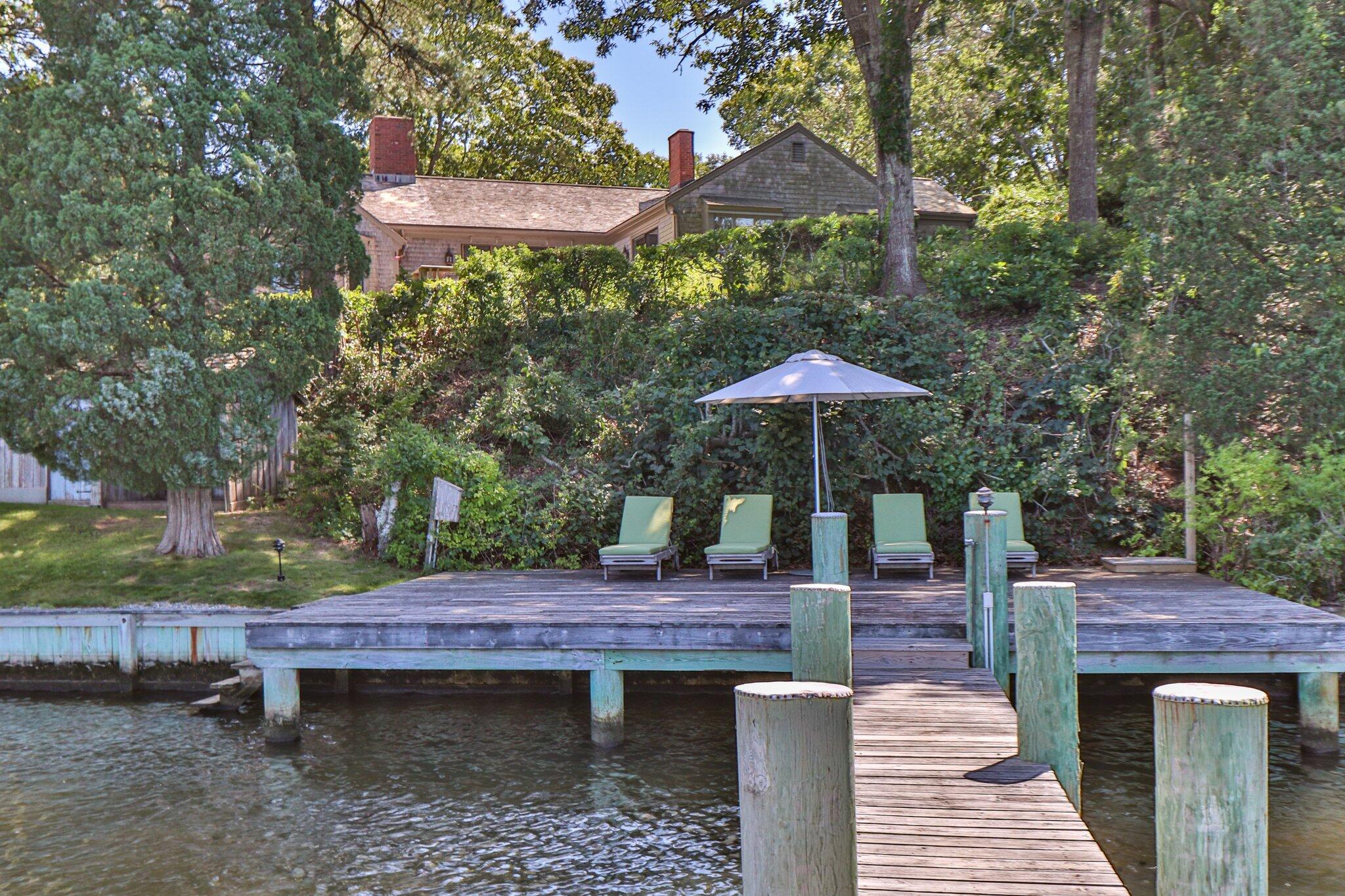 200 North Bay Road Osterville, MA 02655 - Photo 5 of 20 a backyard of a house with table and chairs