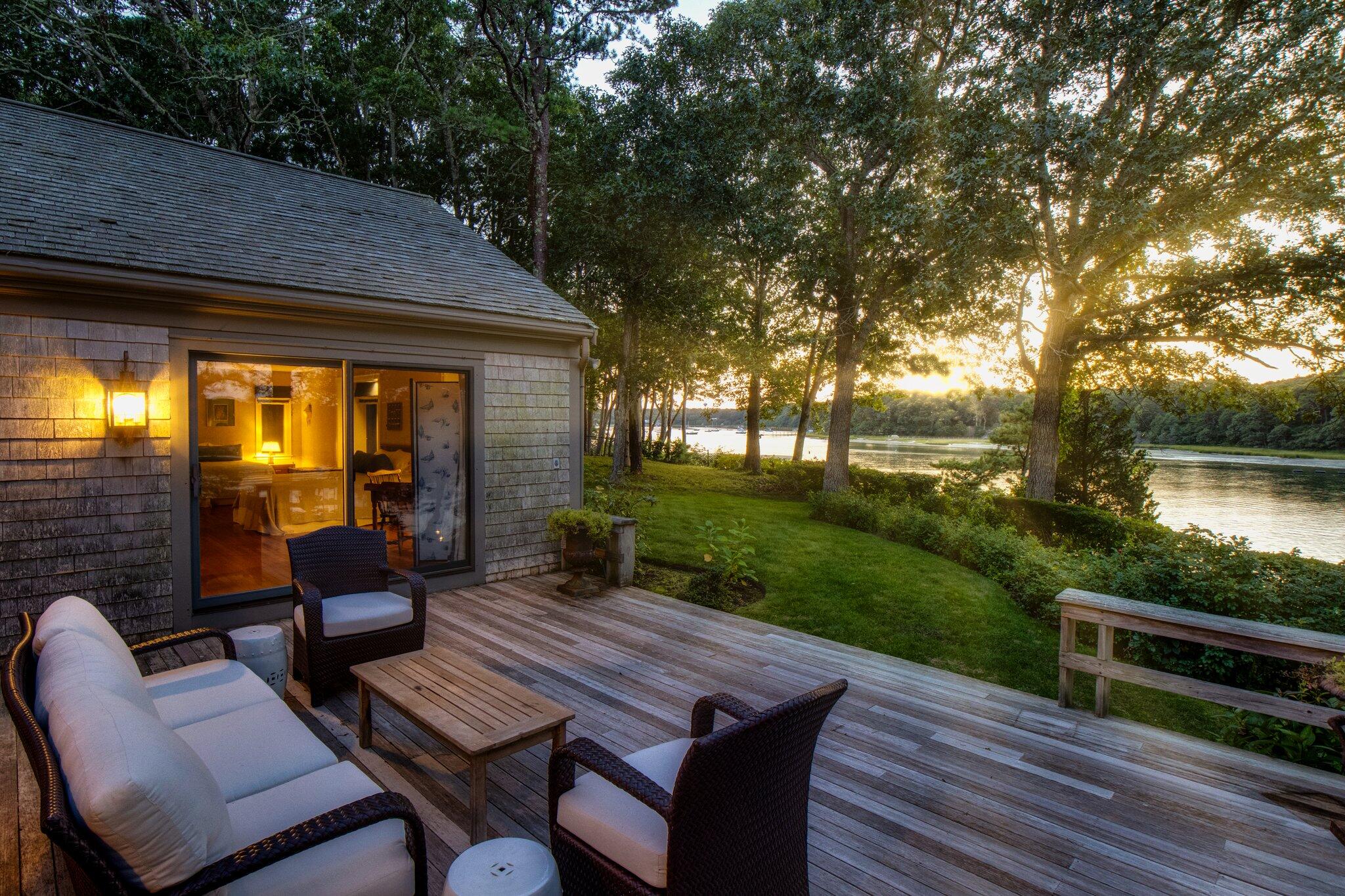 200 North Bay Road Osterville, MA 02655 - Photo 10 of 20 a view of a patio with couches table and chairs and garden view