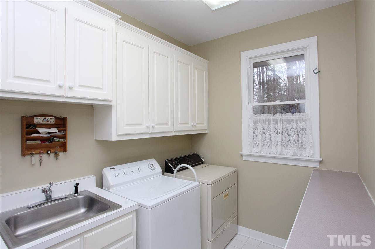 1405 Silverling Way Raleigh, NC 27613 - Photo 15 of 25 a room with storage and utility