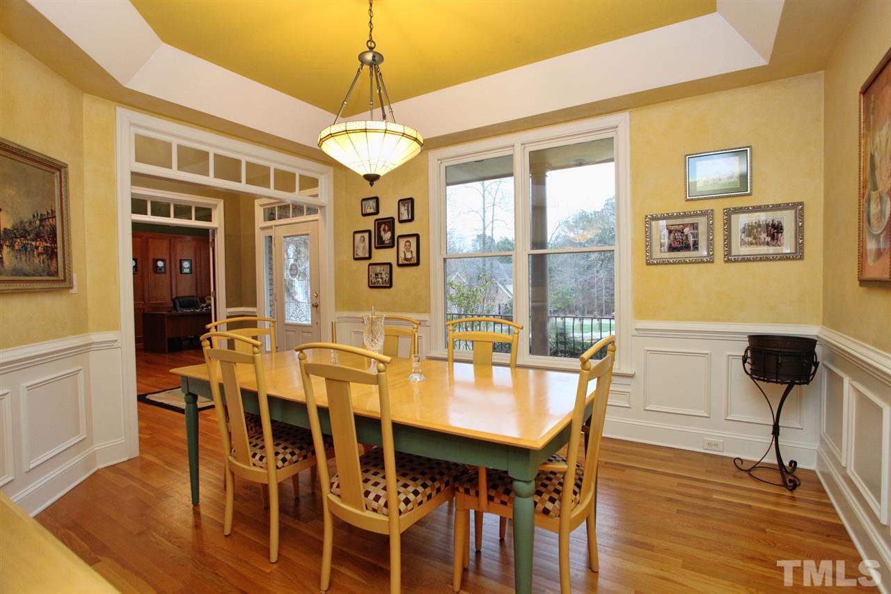 1405 Silverling Way Raleigh, NC 27613 - Photo 3 of 25 a view of a dining room with furniture window and wooden floor