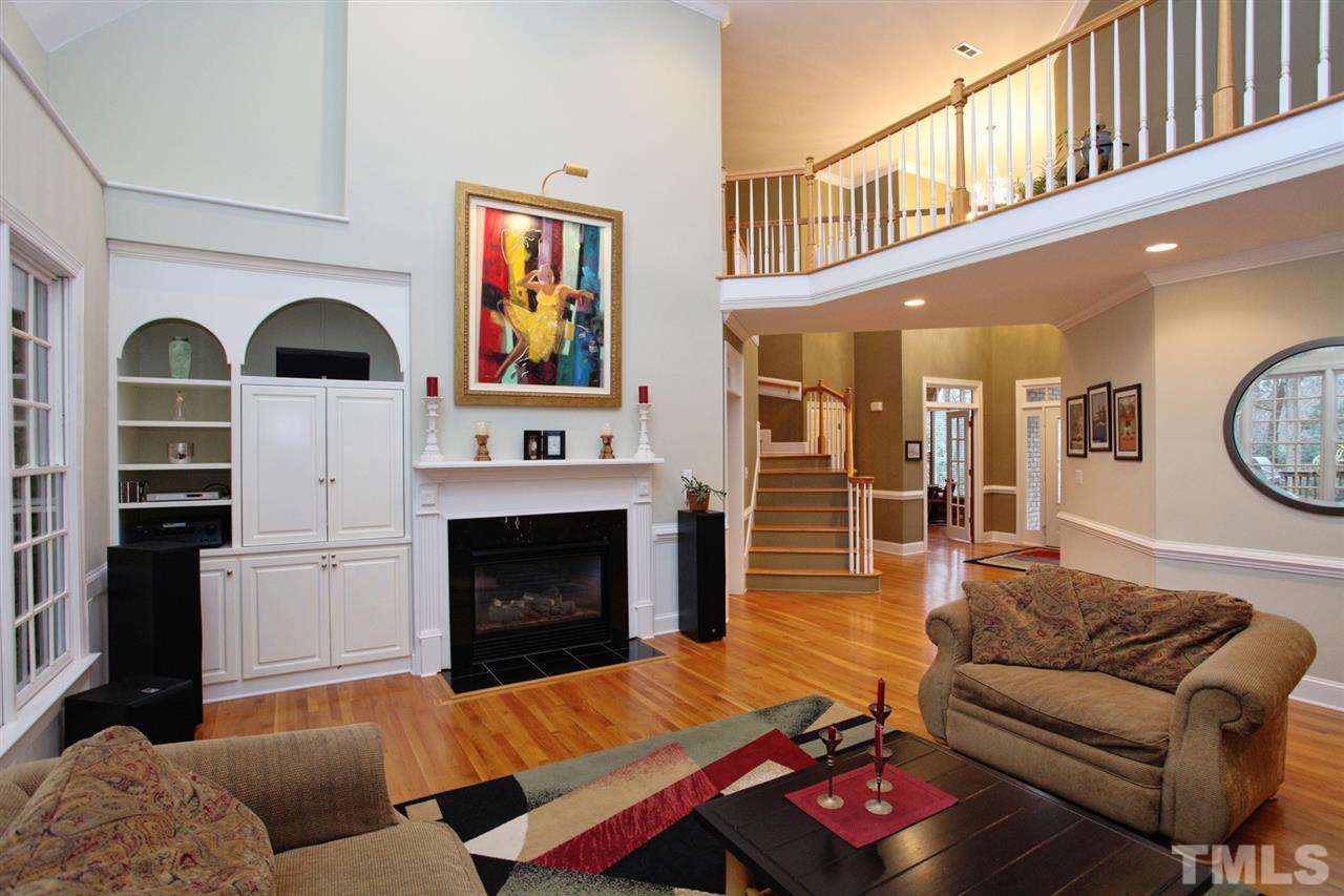 1405 Silverling Way Raleigh, NC 27613 - Photo 4 of 25 a living room with furniture fireplace and flat screen tv