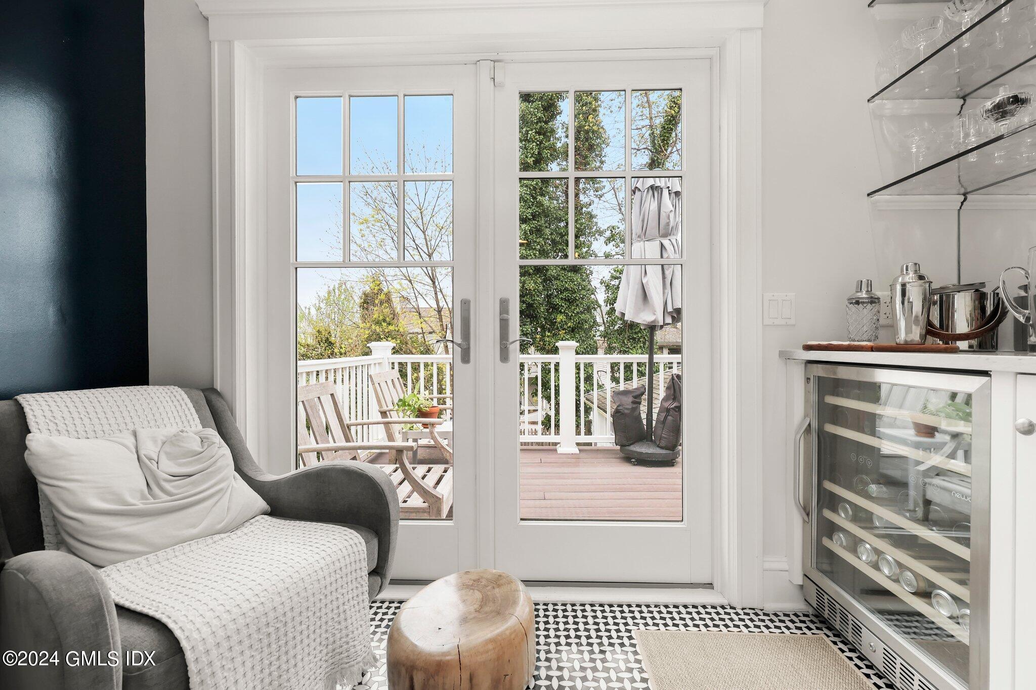 53 Ridge Street Greenwich, CT 06830 - Photo 15 of 26 a living room with furniture a lamp and a window