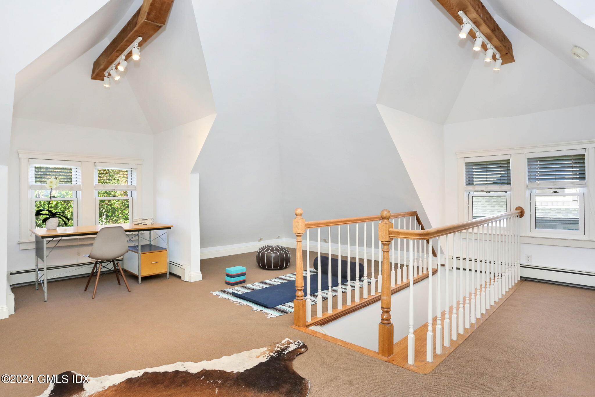 53 Ridge Street Greenwich, CT 06830 - Photo 25 of 26 a living room with furniture and a table