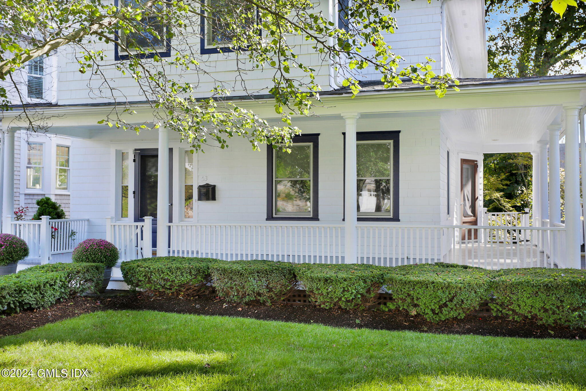 53 Ridge Street Greenwich, CT 06830 - Photo 26 of 26 a front view of a house with a yard