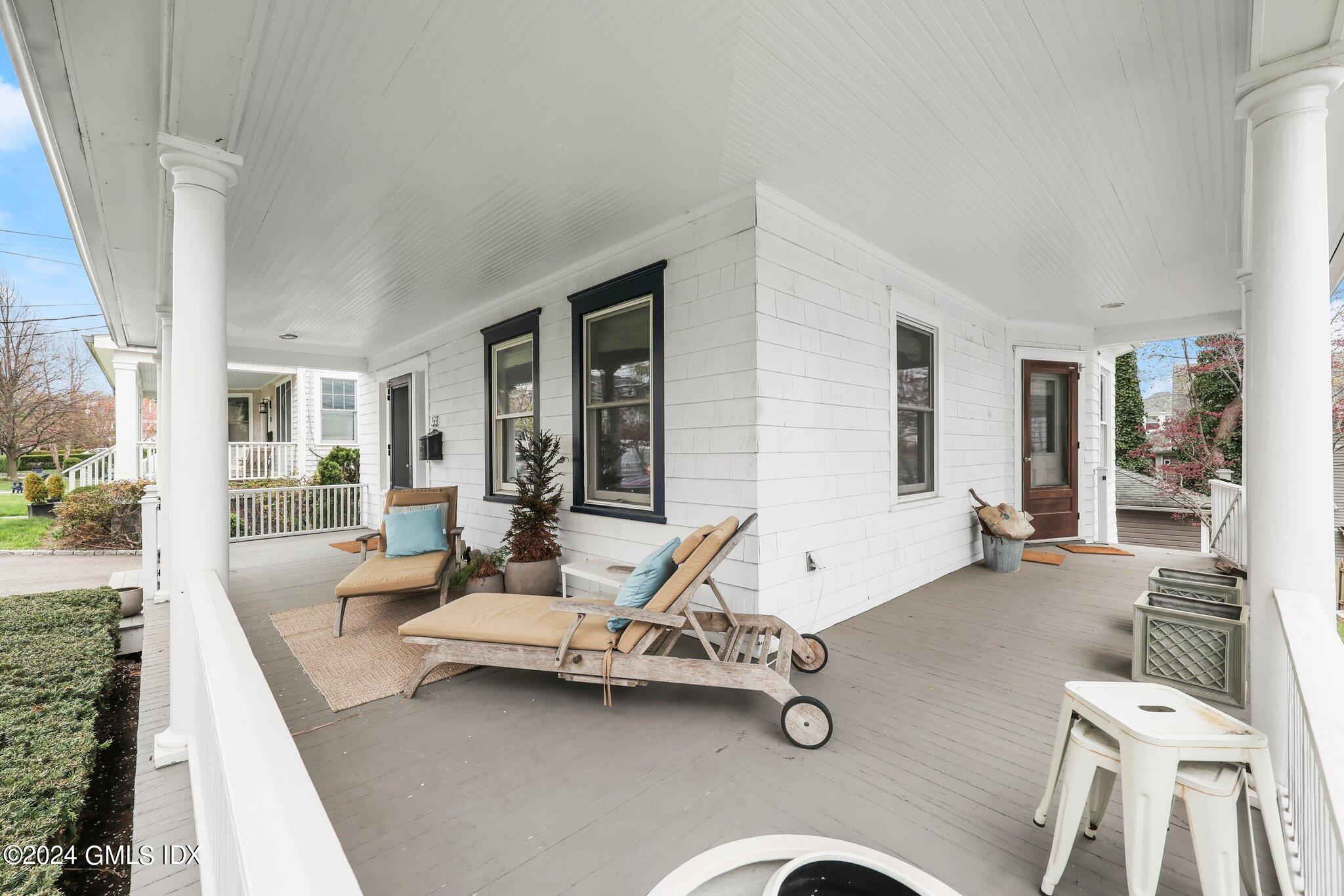 53 Ridge Street Greenwich, CT 06830 - Photo 3 of 26 a living room with patio furniture and a wooden floor