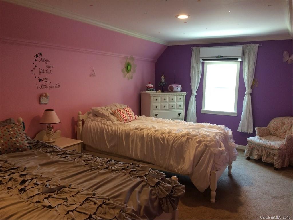 5538 Randolph Road Kannapolis, NC 28081 - Photo 14 of 36 a bedroom with a bed and a window