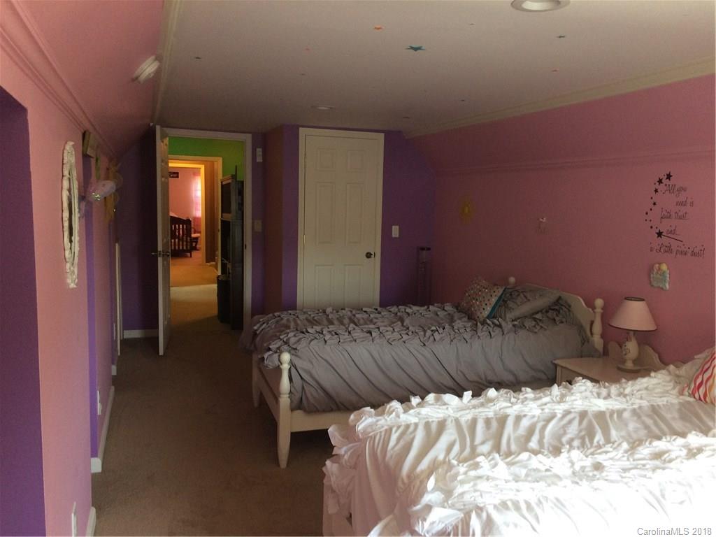 5538 Randolph Road Kannapolis, NC 28081 - Photo 15 of 36 a bedroom with a bed and a mirror