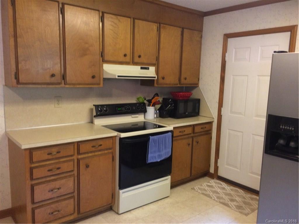 5538 Randolph Road Kannapolis, NC 28081 - Photo 23 of 36 a kitchen with stainless steel appliances granite countertop a refrigerator and a stove