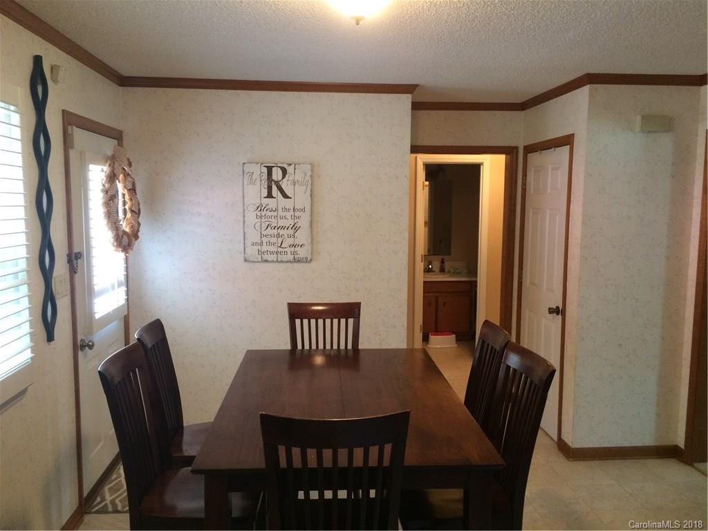 5538 Randolph Road Kannapolis, NC 28081 - Photo 26 of 36 a view of a dining room with furniture window and wooden floor
