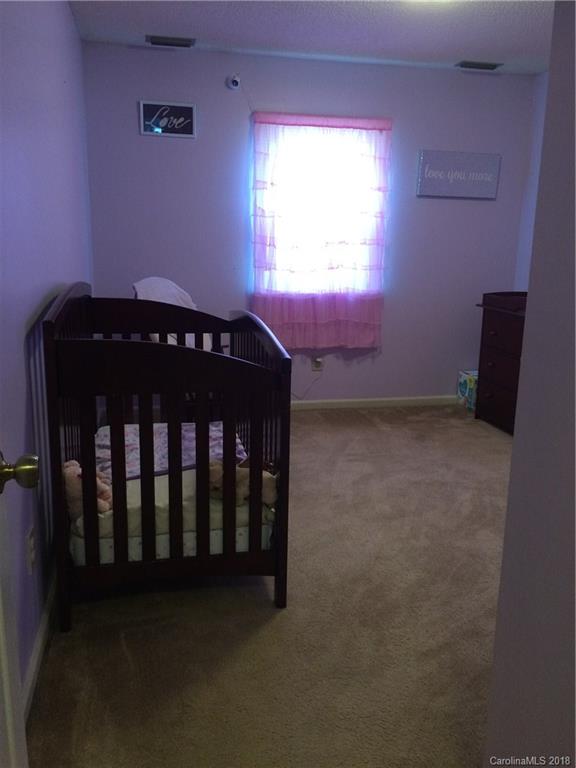 5538 Randolph Road Kannapolis, NC 28081 - Photo 7 of 36 a bedroom with a bed and a window