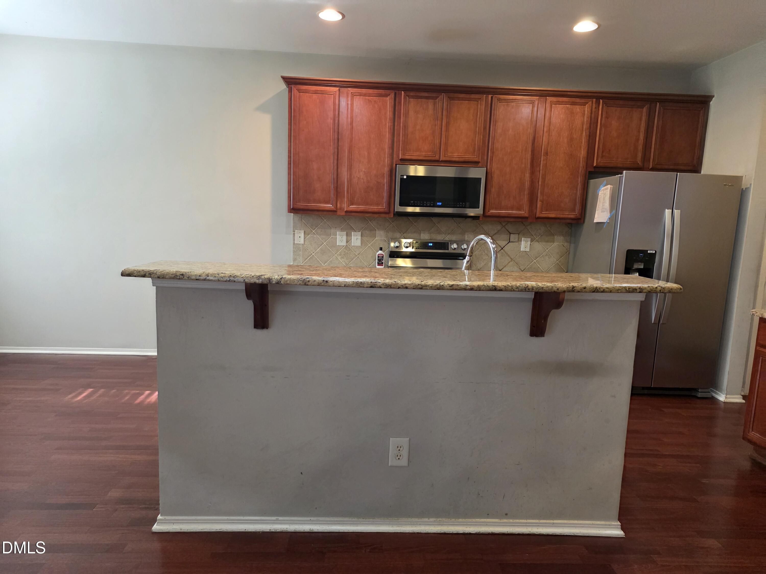 8208 Stone Cellar Drive Raleigh, NC 27613 - Photo 20 of 25 a view of a kitchen with sink and microwave