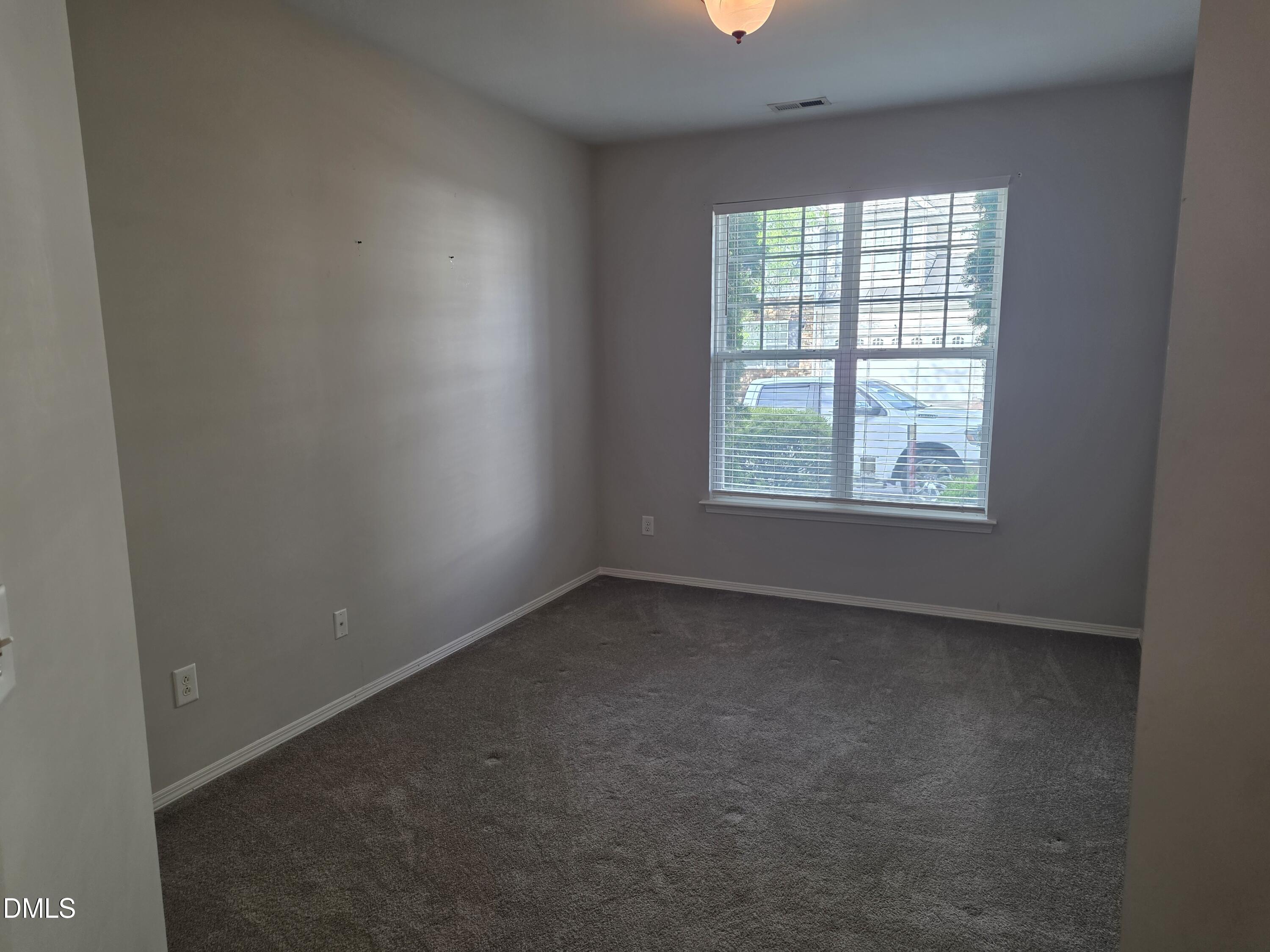 8208 Stone Cellar Drive Raleigh, NC 27613 - Photo 24 of 25 an empty room with a window