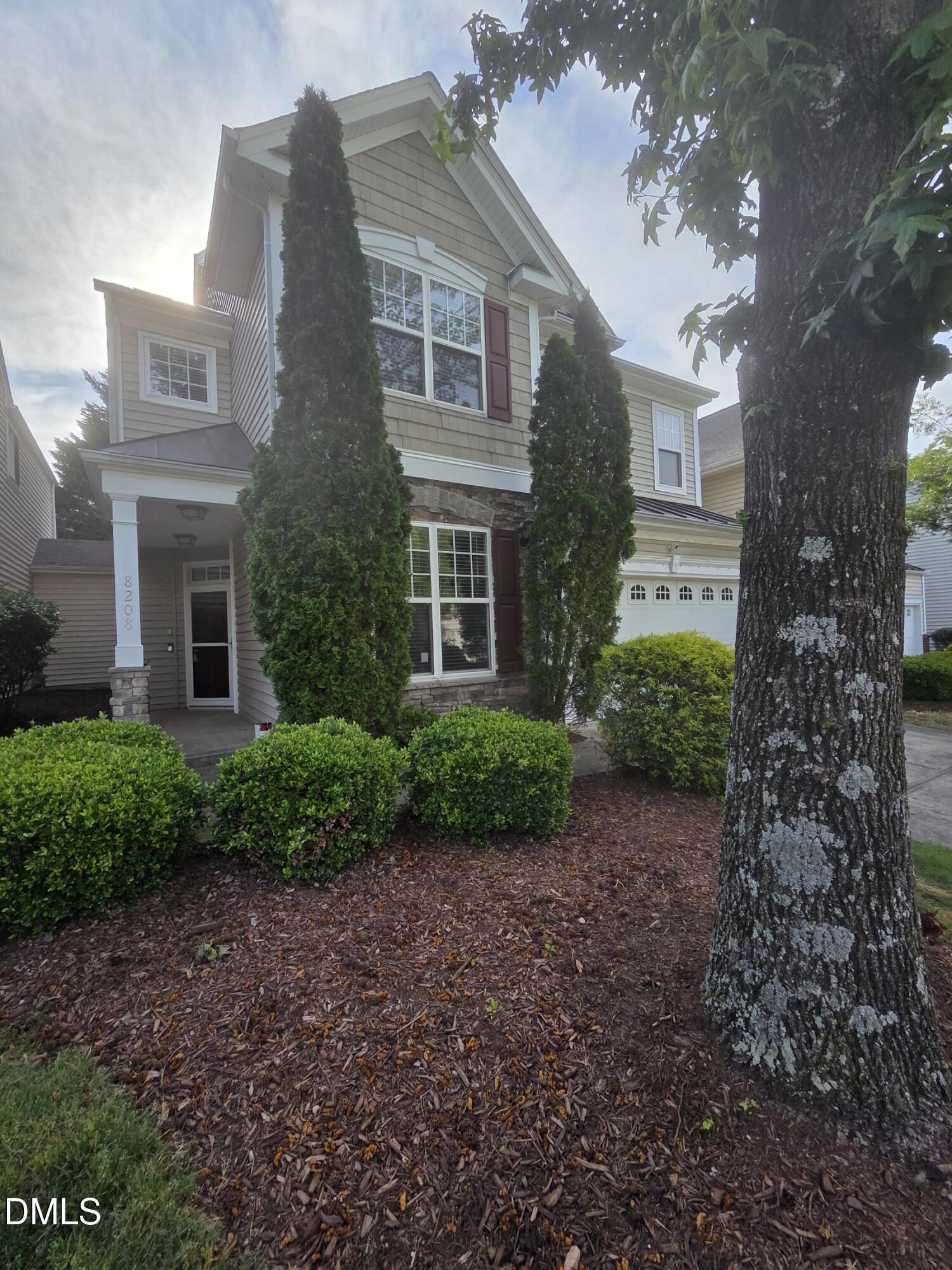 8208 Stone Cellar Drive Raleigh, NC 27613 - Photo 25 of 25 a view of a brick building next to a yard