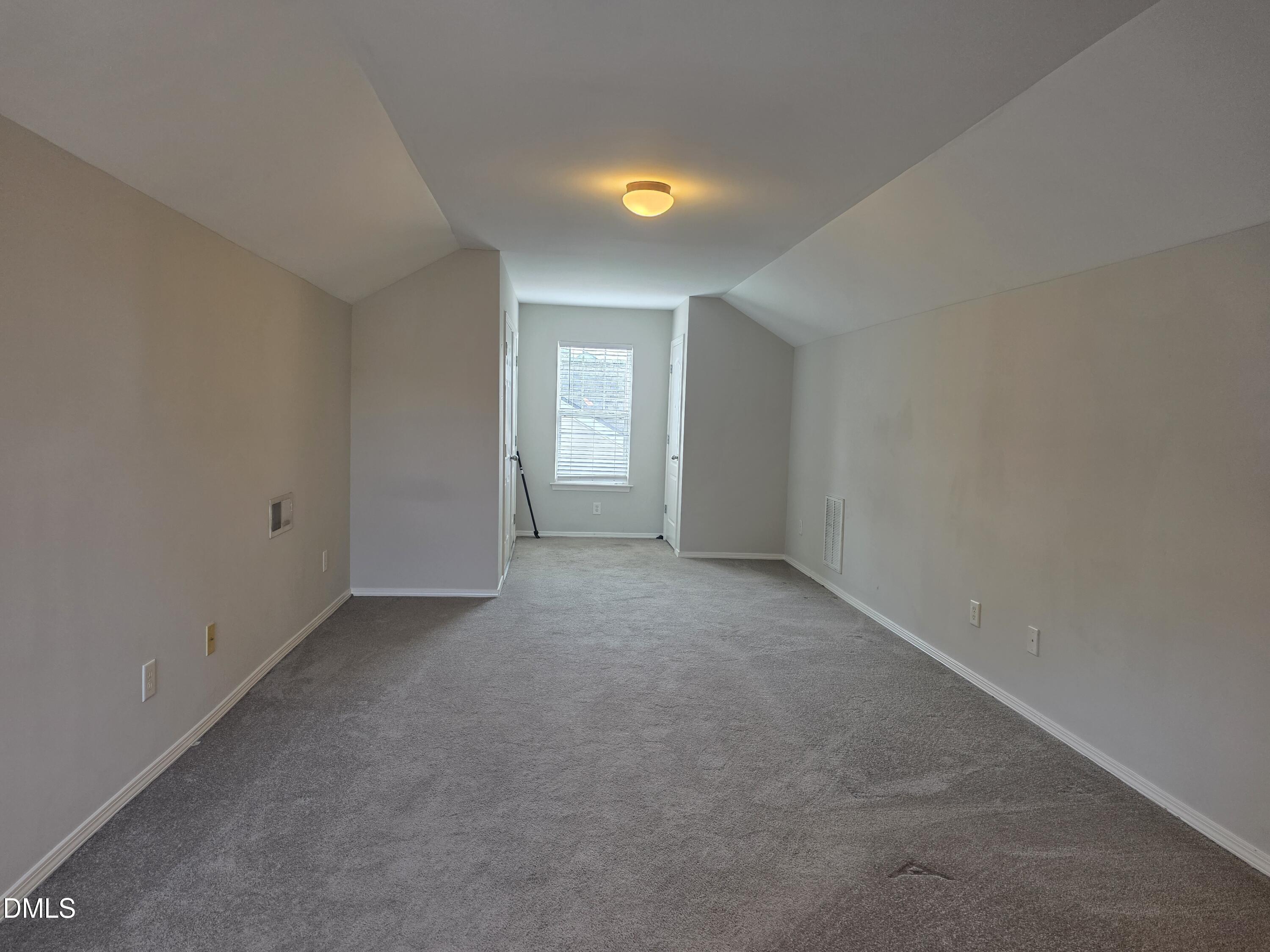 8208 Stone Cellar Drive Raleigh, NC 27613 - Photo 6 of 25 a view of an empty room with a window