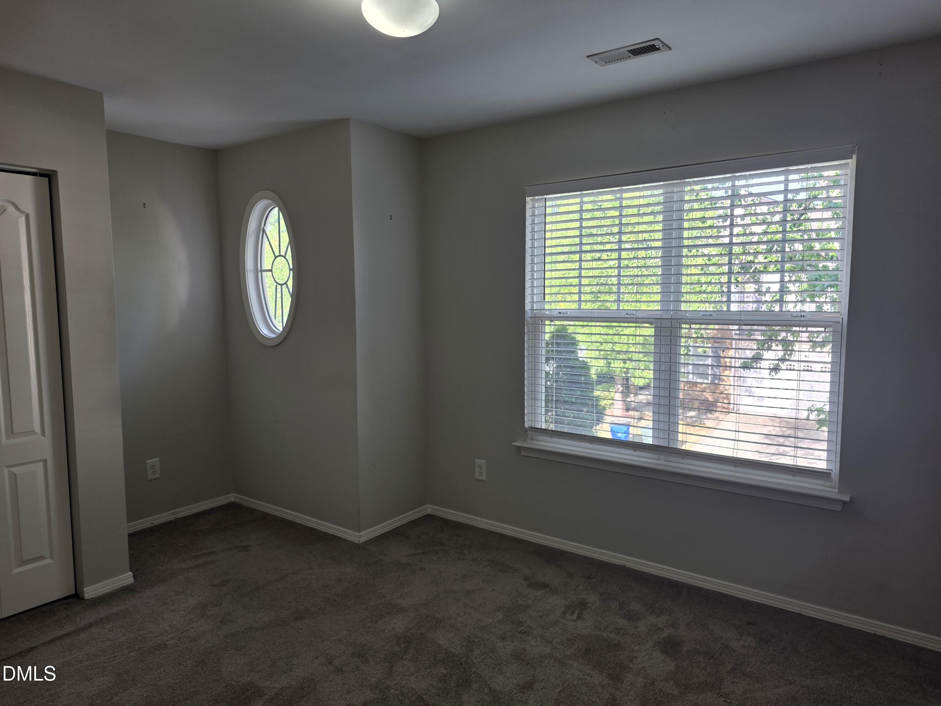 8208 Stone Cellar Drive Raleigh, NC 27613 - Photo 10 of 25 a view of an empty room with a window
