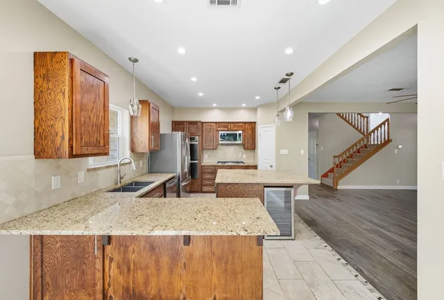 a kitchen with sink and window