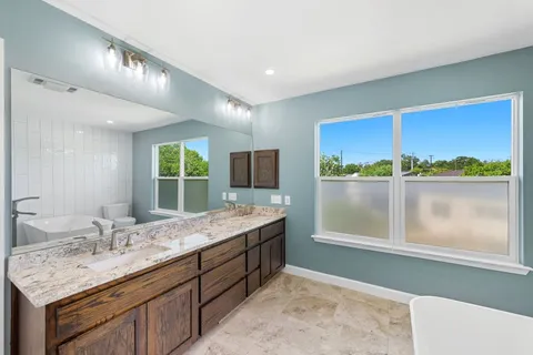 a bathroom with a sink and a window