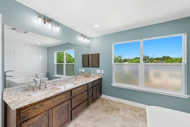 a bathroom with a sink and a window