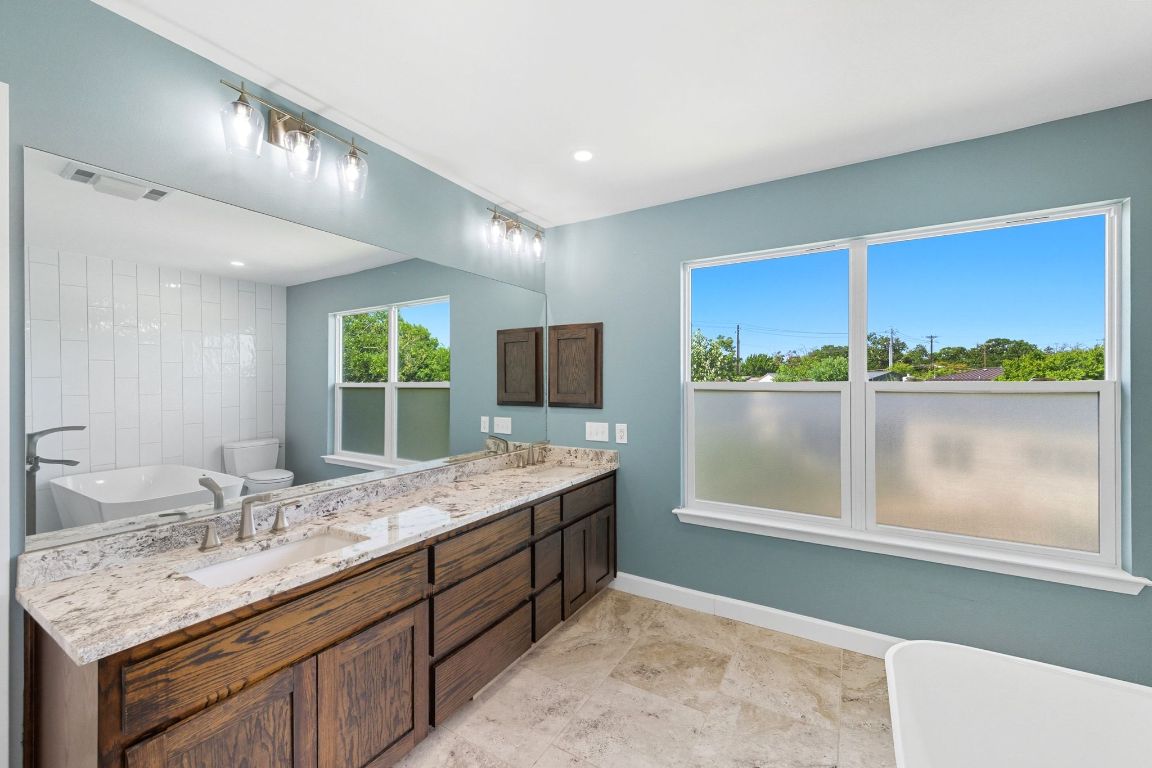1904 Cedar Ridge Drive Austin, TX 78741 - Photo 26 of 40 a bathroom with a sink and a window