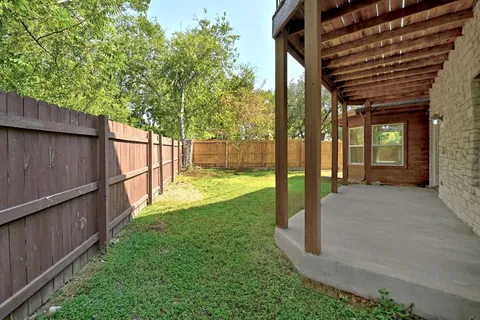 a view of a patio with a backyard
