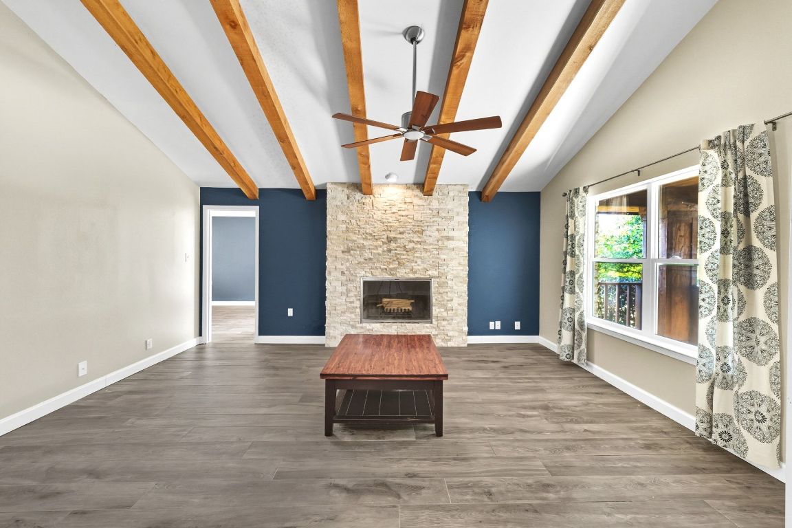 1904 Cedar Ridge Drive Austin, TX 78741 - Photo 7 of 40 a living room with furniture and a fireplace
