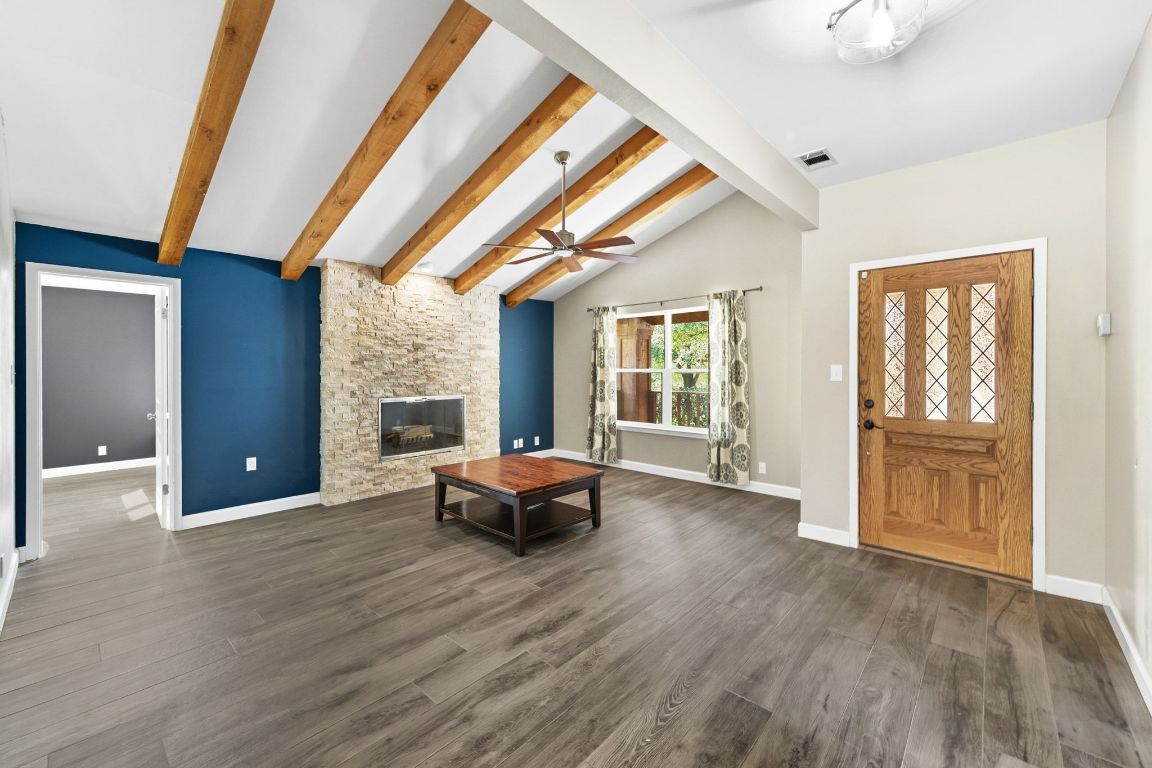 1904 Cedar Ridge Drive Austin, TX 78741 - Photo 8 of 40 a view of a livingroom with wooden floor and furniture