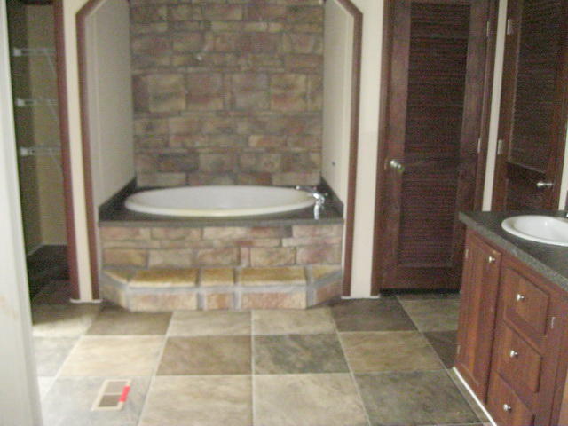 1064 Parrish Road Goodview, VA 24095 - Photo 12 of 21 a bathroom with a granite countertop shower and a sink