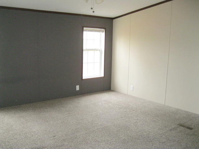 1064 Parrish Road Goodview, VA 24095 - Photo 13 of 21 an empty room with a window