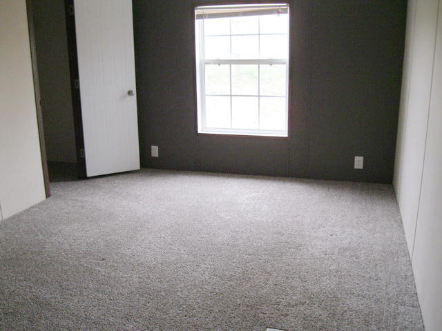 1064 Parrish Road Goodview, VA 24095 - Photo 14 of 21 an empty room with a window