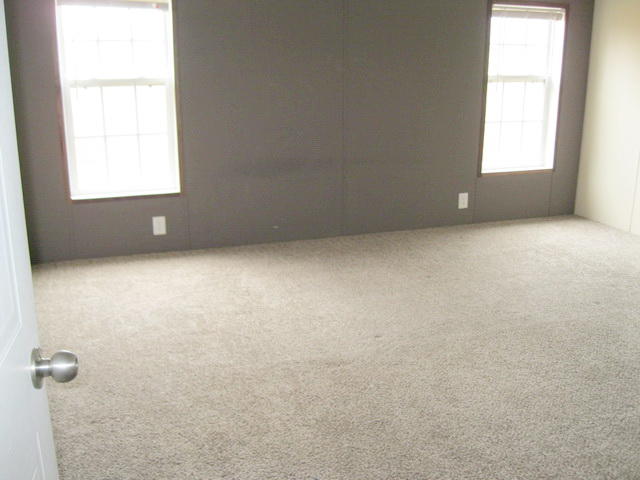 1064 Parrish Road Goodview, VA 24095 - Photo 16 of 21 an empty room with a window